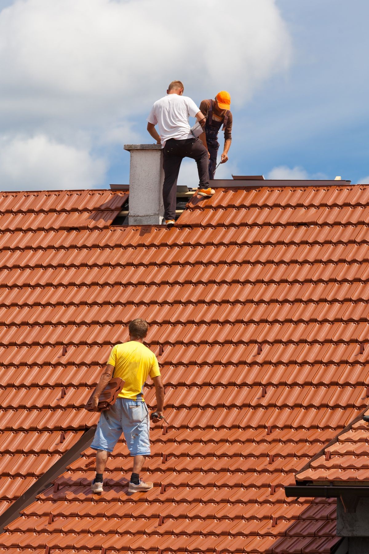 Men working on the roof of a building